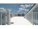 Spacious rooftop deck with white railing and clear views of the neighborhood at 6322 Aureau Ave, Hudson, FL 34667