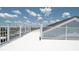 Expansive rooftop deck offering beautiful water views with white railing at 6322 Aureau Ave, Hudson, FL 34667