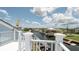 Balcony view overlooking the waterfront featuring a serene canal and neighborhood homes at 6322 Aureau Ave, Hudson, FL 34667