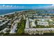 Breathtaking aerial view of a coastal community with ocean access and beautiful residential properties at 639 Garland Cir, Indian Rocks Beach, FL 33785