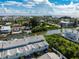 Waterfront condos with private docks sit along the canal, amidst lush landscaping and scenic views from above at 639 Garland Cir, Indian Rocks Beach, FL 33785