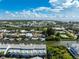 Panoramic aerial view of the coastal landscape, featuring houses alongside a waterway and lush greenery at 639 Garland Cir, Indian Rocks Beach, FL 33785