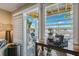 Bright and modern living area with a view of the water and seating outside on the balcony at 639 Garland Cir, Indian Rocks Beach, FL 33785