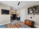 Versatile bedroom with hardwood floors, modern fan, and wooden decor at 639 Garland Cir, Indian Rocks Beach, FL 33785