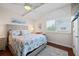 Bedroom features a cozy bed and a large window, with lots of natural light at 639 Garland Cir, Indian Rocks Beach, FL 33785
