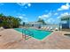 Well-maintained community pool surrounded by lounge chairs, tropical landscaping, and inviting atmosphere at 639 Garland Cir, Indian Rocks Beach, FL 33785