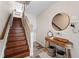 Inviting entryway boasts hardwood stairs, decorative accents, and a warm, welcoming atmosphere at 639 Garland Cir, Indian Rocks Beach, FL 33785