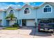 Stylish townhouse with a garage and a well-kept lawn, showcasing a blend of comfort and aesthetic appeal at 639 Garland Cir, Indian Rocks Beach, FL 33785