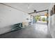 Spacious garage featuring an open garage door to the driveway and storage for recreational items at 639 Garland Cir, Indian Rocks Beach, FL 33785