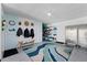 Garage featuring modern floor, organizational tools, cabinets, and a seating area at 639 Garland Cir, Indian Rocks Beach, FL 33785
