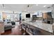 Open-concept kitchen featuring granite countertops, modern appliances, and a view of the living room at 639 Garland Cir, Indian Rocks Beach, FL 33785