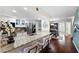 Bright kitchen features granite countertops, white cabinets, and stainless steel appliances at 639 Garland Cir, Indian Rocks Beach, FL 33785