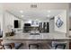 Well-lit kitchen featuring granite countertops, stainless steel appliances, and a convenient breakfast bar at 639 Garland Cir, Indian Rocks Beach, FL 33785