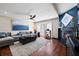 Stylish living room with hardwood floors, a fireplace, and a comfortable sofa, ideal for entertaining at 639 Garland Cir, Indian Rocks Beach, FL 33785
