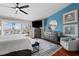 Bright main bedroom features a ceiling fan, plantation shutters, and serene decor at 639 Garland Cir, Indian Rocks Beach, FL 33785