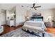 Main bedroom features warm wood floors and a glimpse into the ensuite bathroom at 639 Garland Cir, Indian Rocks Beach, FL 33785