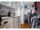 Spacious walk-in closet with built-in shelves and ample storage at 639 Garland Cir, Indian Rocks Beach, FL 33785