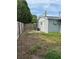 Large, fenced backyard providing privacy and security; some grass and mostly patchy dirt at 7222 Coventry Dr, Port Richey, FL 34668