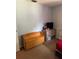 Cozy bedroom featuring neutral walls and a wooden bench at 7222 Coventry Dr, Port Richey, FL 34668