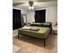 Inviting bedroom featuring neutral walls, ceiling fan, and view into the room at 7222 Coventry Dr, Port Richey, FL 34668