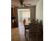 Casual dining area with an elegant table beneath a ceiling fan, perfect for intimate meals at 7222 Coventry Dr, Port Richey, FL 34668