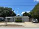 Charming single-story home featuring a well-maintained lawn and mature trees at 7222 Coventry Dr, Port Richey, FL 34668