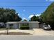 Charming home with well-maintained lawn, mature trees, and inviting curb appeal, parked car at 7222 Coventry Dr, Port Richey, FL 34668