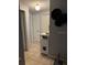 Hallway with tiled floors and doorway that leads into other rooms of the home at 7222 Coventry Dr, Port Richey, FL 34668