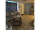 Comfortable living room featuring tile flooring and cozy seating at 7222 Coventry Dr, Port Richey, FL 34668