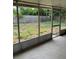 Screened in porch with a view of the outdoor area of the home at 7222 Coventry Dr, Port Richey, FL 34668