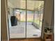 Enclosed outdoor patio with tiled floor, offering a relaxing space for outdoor leisure and entertainment at 7222 Coventry Dr, Port Richey, FL 34668