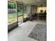 Enclosed screened patio with access to backyard; the perfect indoor outdoor living space at 7222 Coventry Dr, Port Richey, FL 34668