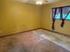 Bright bedroom with carpeting, a window, neutral colored walls and a fan at 7239 Lykes Dublin Rd, Brooksville, FL 34601
