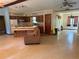 Functional kitchen featuring wooden cabinetry, essential appliances, and a convenient breakfast bar at 7239 Lykes Dublin Rd, Brooksville, FL 34601