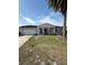 Charming single-story home featuring a lush front yard and a welcoming covered front porch at 7540 Briarwood Dr, Port Richey, FL 34668