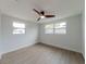 Bedroom featuring lots of natural light and ceiling fan at 7608 Bougenville Dr, Port Richey, FL 34668