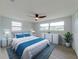 Bedroom featuring lots of natural light, ceiling fan and modern decor at 7608 Bougenville Dr, Port Richey, FL 34668