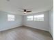 Bedroom featuring lots of natural light and ceiling fan at 7608 Bougenville Dr, Port Richey, FL 34668