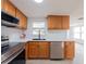 Modern kitchen with stainless steel appliances, a black faucet, and bright countertops at 7608 Bougenville Dr, Port Richey, FL 34668