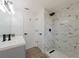 Bathroom shower featuring white marble tile and black hardware at 7608 Bougenville Dr, Port Richey, FL 34668