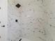 Close up of bathroom shower featuring white marble tile and black hardware at 7608 Bougenville Dr, Port Richey, FL 34668