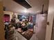 View of a cluttered basement with storage and appliances at 7631 Briarwood Dr, Port Richey, FL 34668