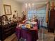 Dining room with vintage furniture and personal items at 7631 Briarwood Dr, Port Richey, FL 34668