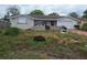 Street view of the exterior elevation of the home at 7631 Briarwood Dr, Port Richey, FL 34668