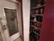 Image of a white door with window and view of shelved items at 7631 Briarwood Dr, Port Richey, FL 34668