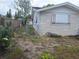 View of the side yard and the gate leading to the backyard at 7631 Briarwood Dr, Port Richey, FL 34668