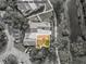 Aerial view showcasing property lines, landscaping, and surroundings, offering a sense of location and neighborhood at 8158 Sturbridge Ct # D, Weeki Wachee, FL 34613