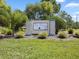 Welcome to The Bluffs! A beautiful sign inviting you to a community with natural beauty at 8158 Sturbridge Ct # D, Weeki Wachee, FL 34613