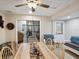 Bright dining room with seating for six, tile floors and a doorway leading to other rooms at 8158 Sturbridge Ct # D, Weeki Wachee, FL 34613