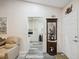 Welcoming entryway flows into the kitchen, showcasing stylish flooring and tasteful decor throughout at 8158 Sturbridge Ct # D, Weeki Wachee, FL 34613
